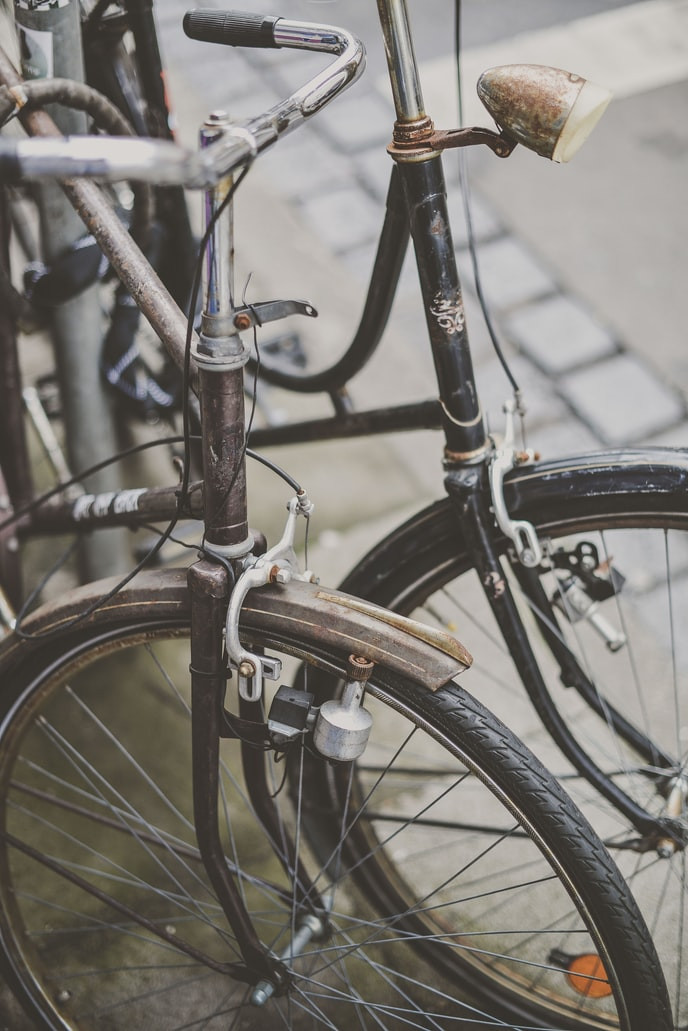 Man holding bicycle wheel