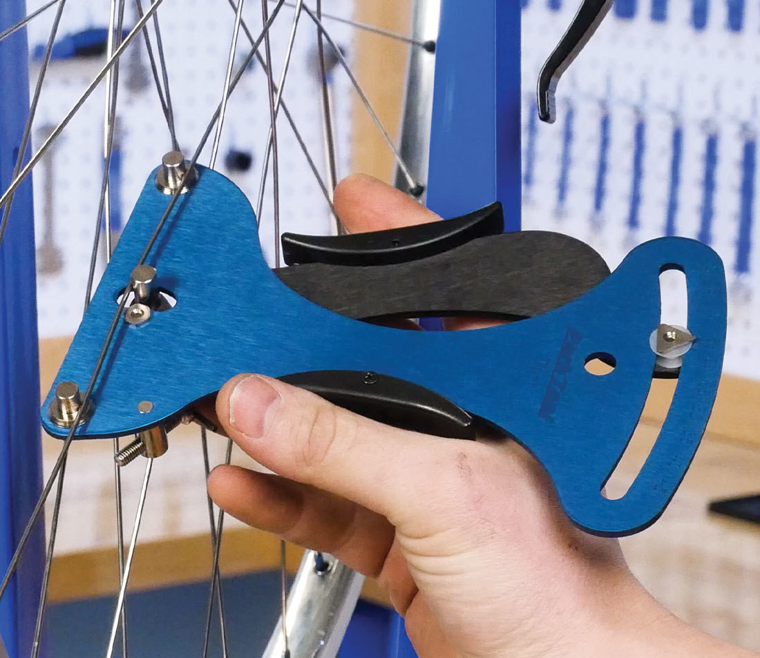 Measuring bicycle spoke tension using a spoke tensiometer