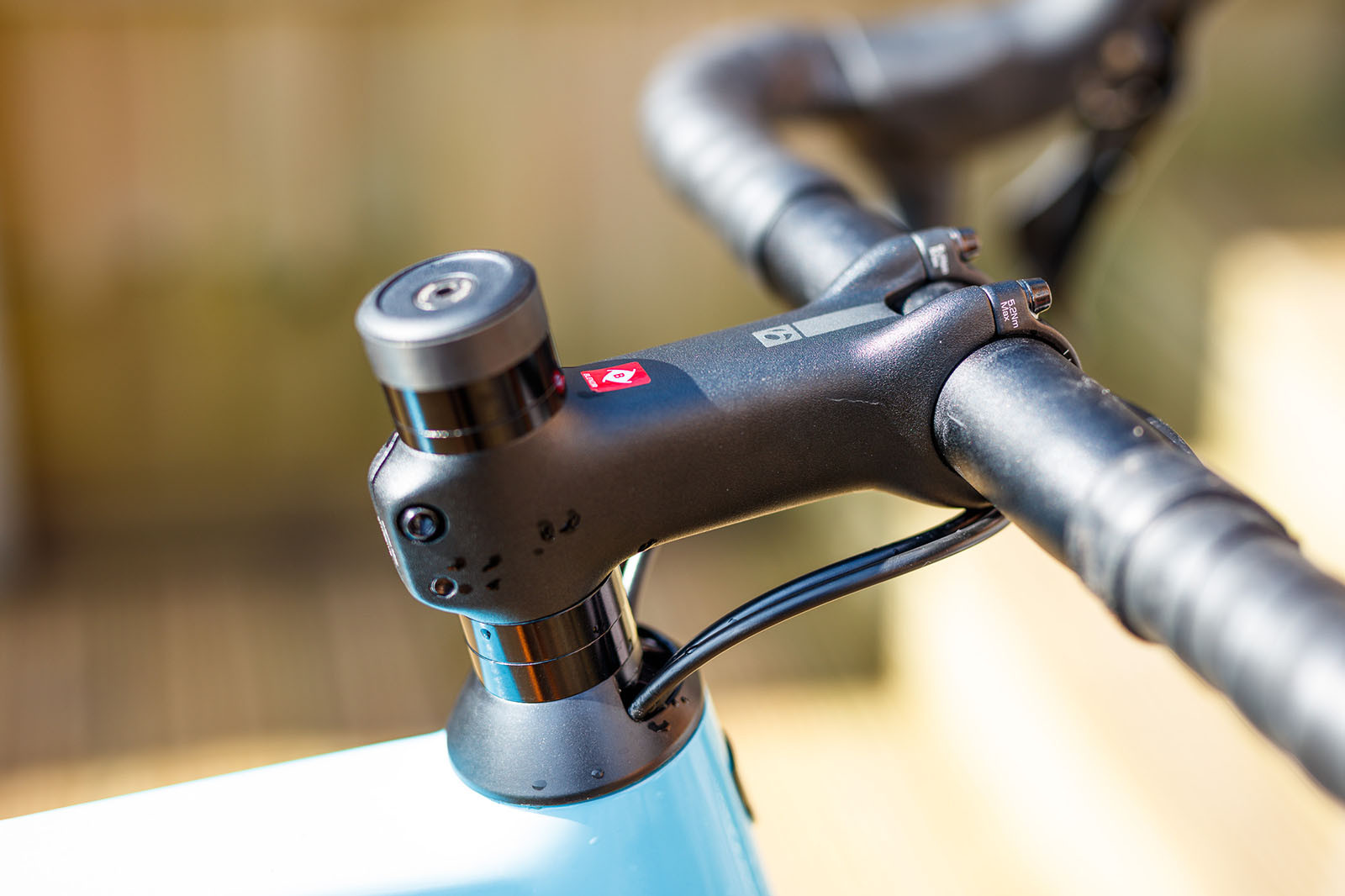 A biker adjusting the handlebars for a more comfortable and upright position, potentially relieving groin pain