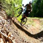 Rider descending on a mountain bike