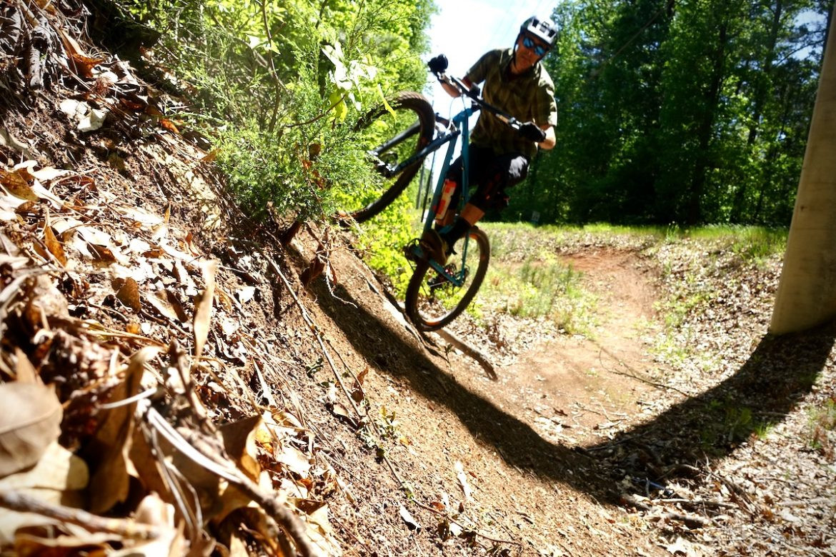 Rider descending on a mountain bike