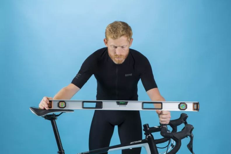 rider measures bike fit